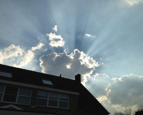 ray of sun over roof